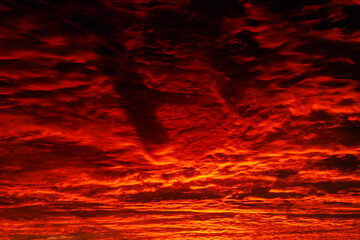 Red and orange clouds at sunrise or sunset.