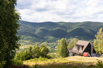 old wooden house in spring Carpathian mountains in Ukraine