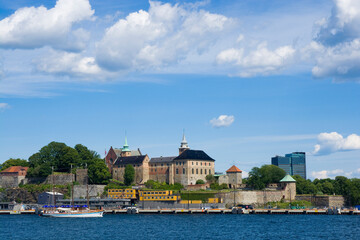 Fototapeta na wymiar Sailing ship in Oslofjord, Akershus Castle and Fortress in the background, Oslo, Norway