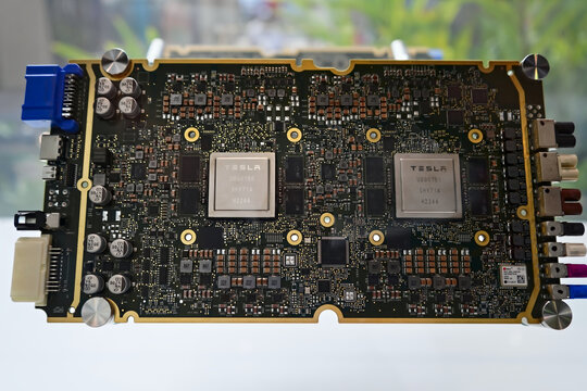 Honolulu, Hawaii -  Jan. 12, 2024: Tesla FSD, full self driving dual ai beta processor and motherboard brain technology close up on display. Macro photo with selective focus.