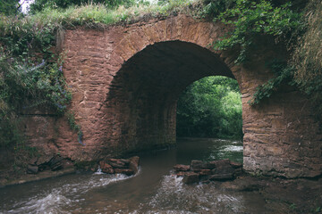 arched bridge across the river. ancient arch. bridge across the river