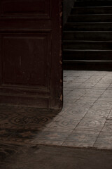 doors, stairs and tiles on the floor in the old house