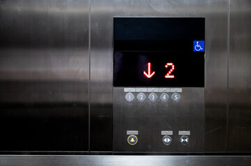 Lift or Elevator buttons and wall inside.Accessible elevator push buttons with numbers.Up and down...