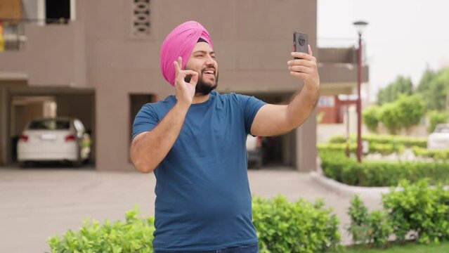 Happy Sikh Indian Man Talking on Video Call