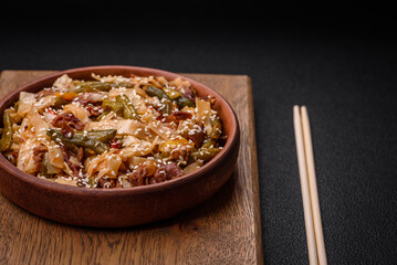 Delicious Asian dish udon with hot peppers, green beans, spices and herbs