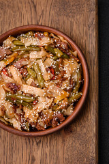 Delicious Asian dish udon with hot peppers, green beans, spices and herbs