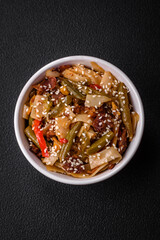 Delicious Asian dish udon with hot peppers, green beans, spices and herbs