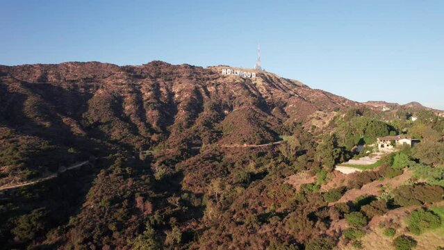 Establisching shot of Hollywood Sign in Los Angeles at sunset drone flight towards white letters