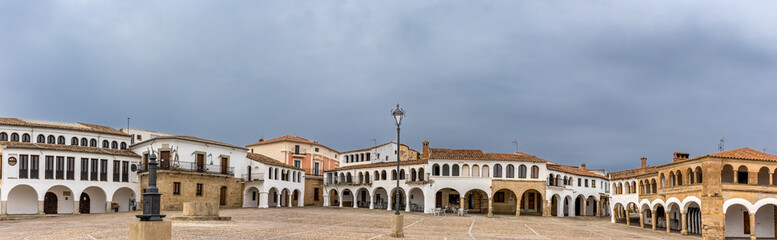 Panoramic photograph of the spectacular main square of Garrovillas de Alcon&eacute;tar. The square is made up of perfectly white washed houses with generous arcades. C&aacute;ceres, Spain
