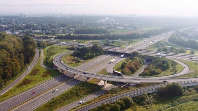 Cologne, Germany - September 24 2023 drone shot of german highway A1 and A4 with trucks and cars driving at daytime