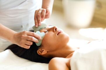 Obraz na płótnie Canvas Face massage or beauty treatment in spa salonFace massage or beauty treatment in spa salon