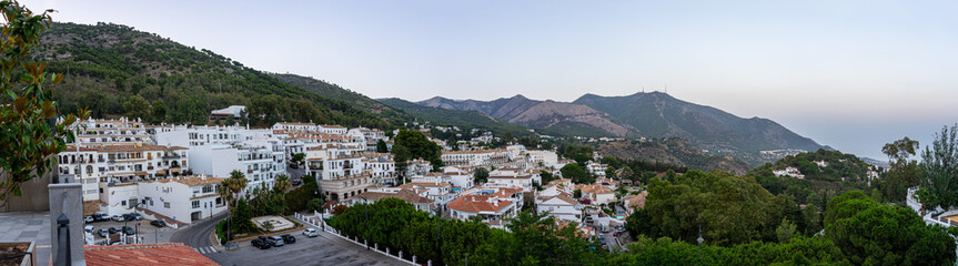 Fototapeta na wymiar Panoramic night view of white houses in Mijas, Spain