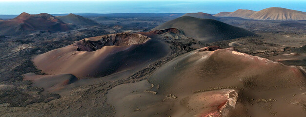 Astunning view of a volcano crater, desert, mountains and volcanoes on the Lanzarote island.