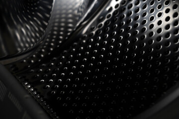 Background with shiny metal, black carbon fiber surface.