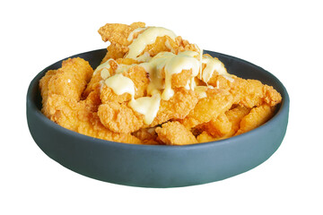 Close-up view of a bowl filled with crispy, fried chicken pieces drizzled with a savory sauce