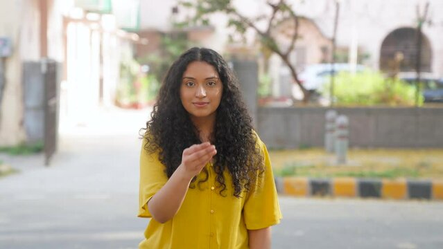 Indian Girl with Curly Hair Doing Adab