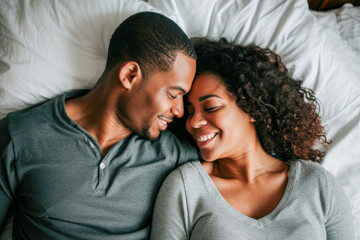 Smiling couple on bed, time to family, concept family