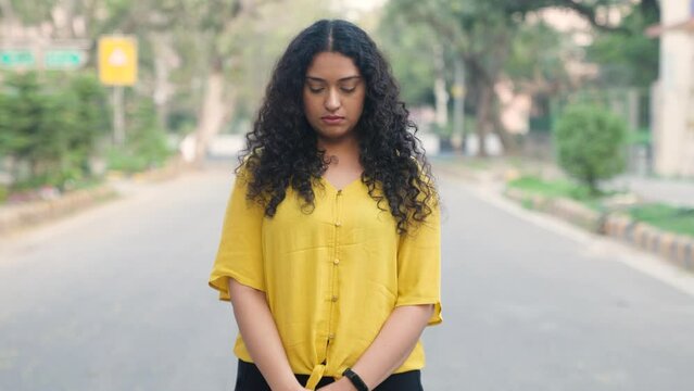 Indian Girl with Curly Hair feeling Guilty