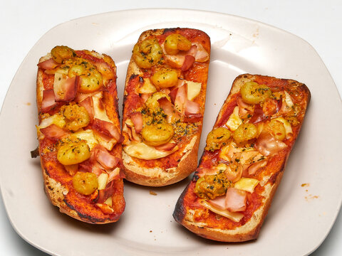Cheesy Garlic Bread with Ham and Herbs, Comfort Food Concept