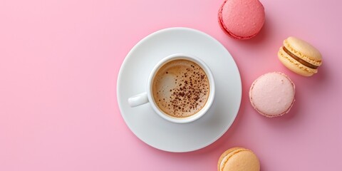 Obraz na płótnie Canvas Top view of cup of coffee with macaron on pink background. Minimalist concept of food.