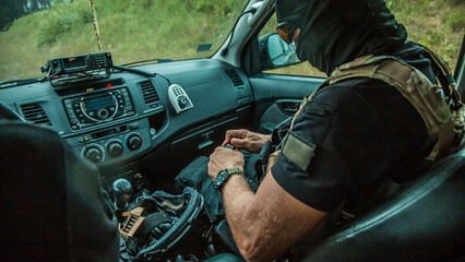  tactical professional ready in a vehicle with communications equipment and gear for a critical...