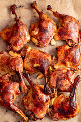 fried duck leg. roasted duck legs on a baking tray