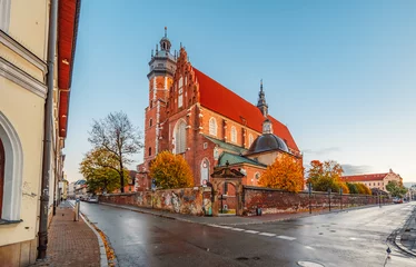 Poster Corpus Christi Basilica famous landmark in Krakow Poland. Landscape on coast river Wisla © alexanderuhrin