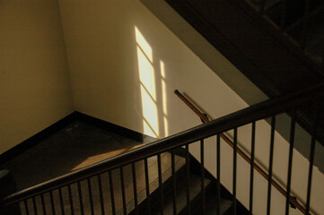 Window outline formed by shadows along a staircase