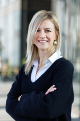 Portrait of young adult businesswoman in formal dress outdoors. Happy confident business woman...
