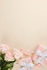 Radiant women: unwrapping the joy of International Women's Day gifts. Top view vertical flat lay of present boxes, heart-shaped candles, hearts, pink roses on beige background with advert panel