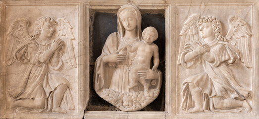 NAPLES, ITALY - APRIL 21, 2023: The marble relief of renaissance Madonna among the angels in the...