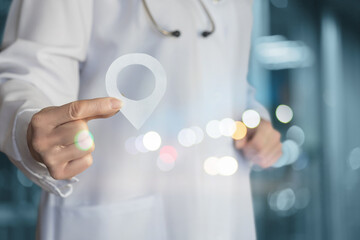 Close up of female doctor hand holding a map pin .