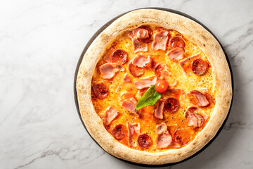 Italian sausage and cheese pizza served on a pristine white marble table. Culinary perfection. High quality photo