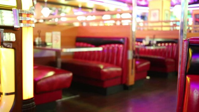 Red leather couches in modern restaurant. Shallow dof