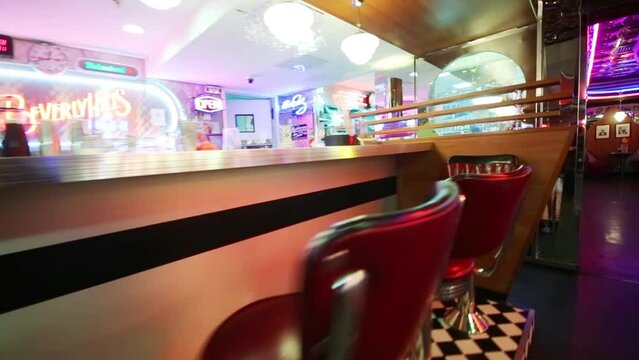 Red seats in bar in Beverly Hills Diner - network of restaurants