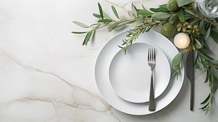 a festive summer wedding scene, focusing on a marble table setting with cutlery for one person, adorned with olive branches, white peony flowers, a ceramic plate, and a silk ribbon. - obrazy, fototapety, plakaty