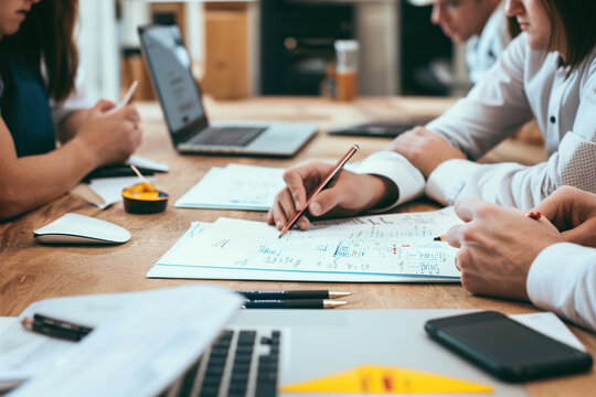 Team members collaborating on a shared project or brainstorming session.