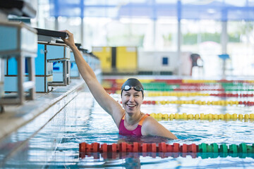 Portrait of a woman, a professional swimmer in the athletic pool