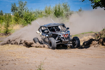 UTV vehicle offroad kicking up sand on dune. Extreme, adrenalin. 4x4.