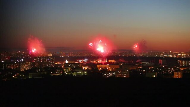 Beautiful fireworks Red Hearts above big city at night