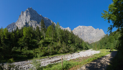 The morning panorama of north walls of Karwendel mountains - walls of Spritzkar spitze and...