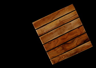 Cutting board isolated on black, top view