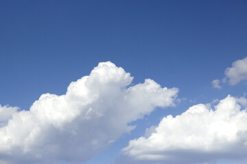 warm and windy blue sky with white clouds
