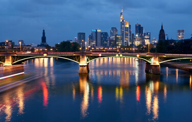 Fototapeta na wymiar The Main river view on the downtown of Frankfurt at blue hour, Germany