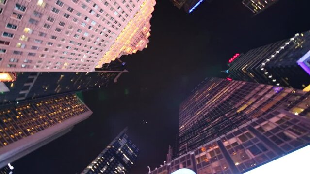 Highrise buildings upward at Broadway in the evening time.