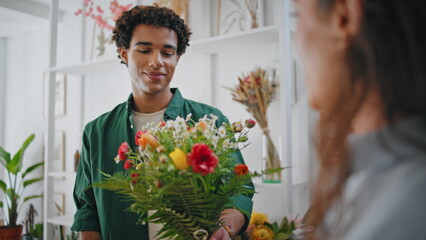 Black skin flower customer buy beautiful floristry art craft in florist shop. - Powered by Adobe