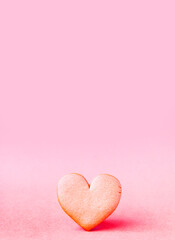 Heart shaped cookie on soft light background