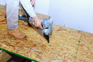 In new home, wooden plywood was installed for flooring an air nail gun was used to secure plywood