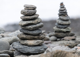 Fototapeta na wymiar Close up of pebbles stacked on on a rocky beach
