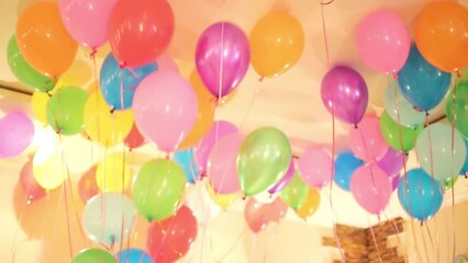 Multicolored balloons filled with helium on the holiday